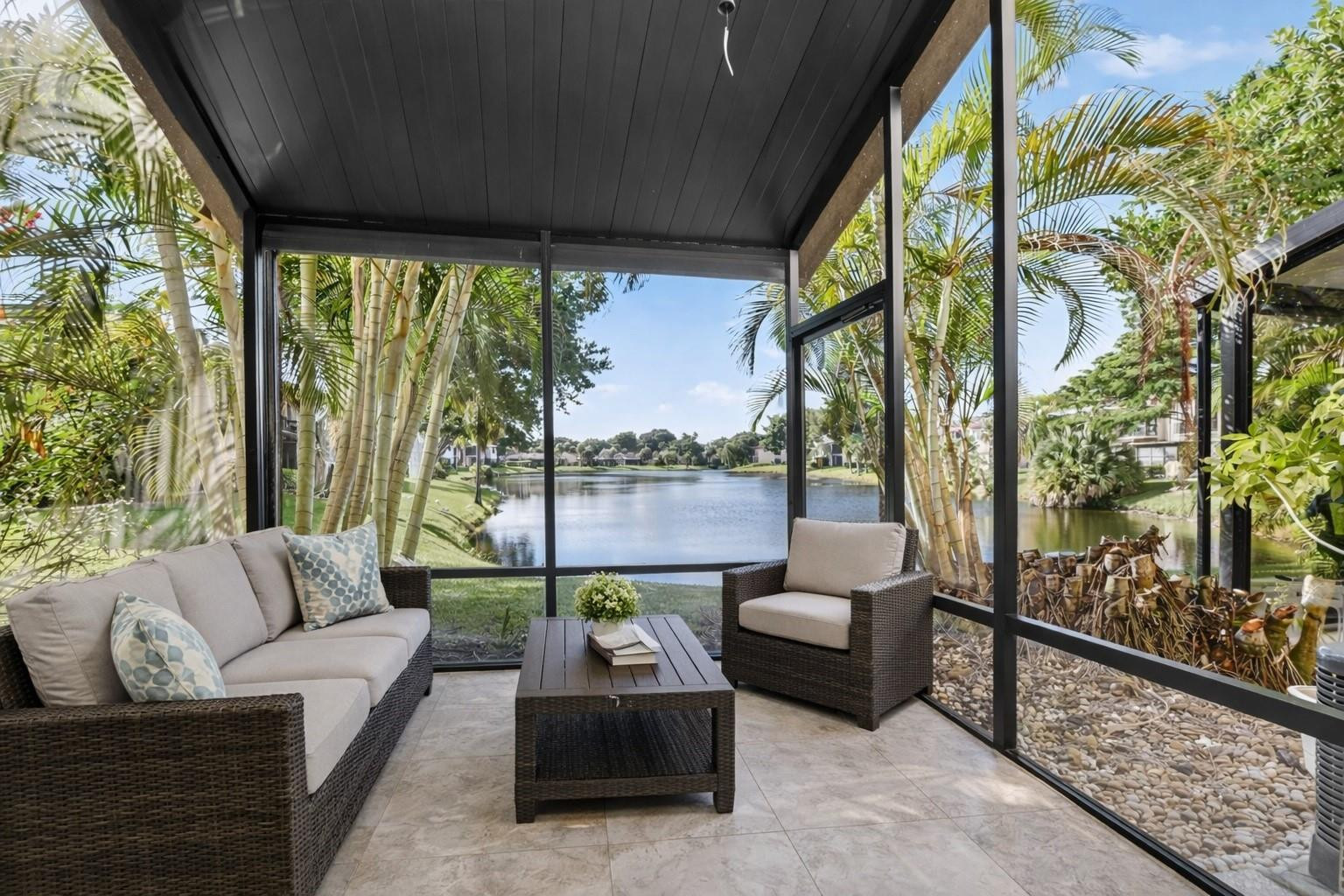 21476 Juego Circle, Unit 8C Boca Raton, FL 33433 - Photo 39 of 54 a living room with furniture and a large window
