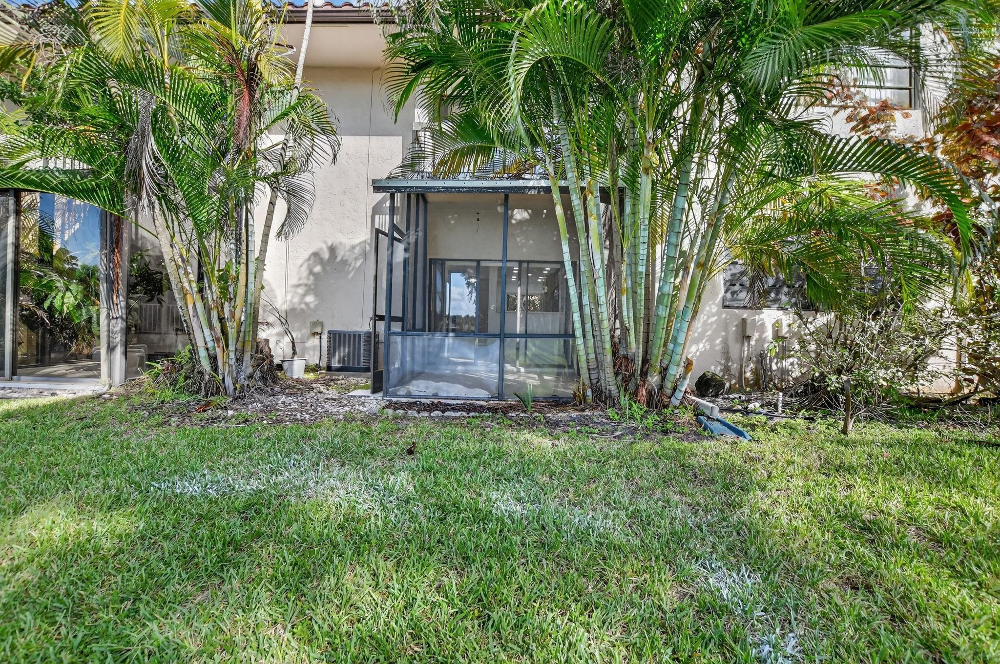 21476 Juego Circle, Unit 8C Boca Raton, FL 33433 - Photo 42 of 54 front view of a house with a tree