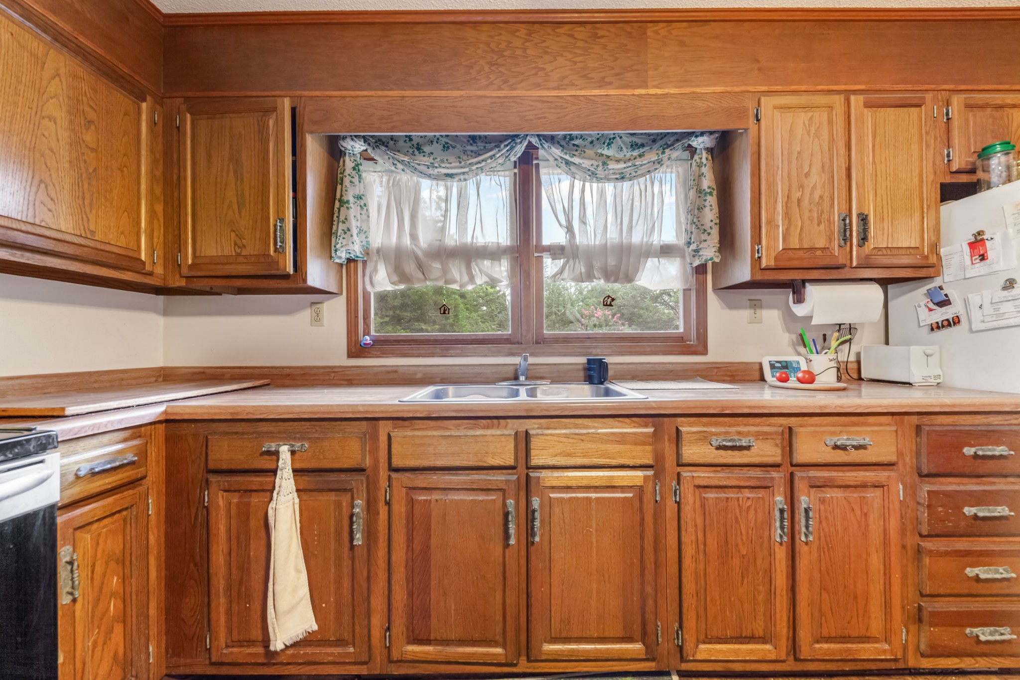 2756 Glasscock Road Lewisburg, TN 37091 - Photo 11 of 48 a kitchen with wooden cabinets and a window