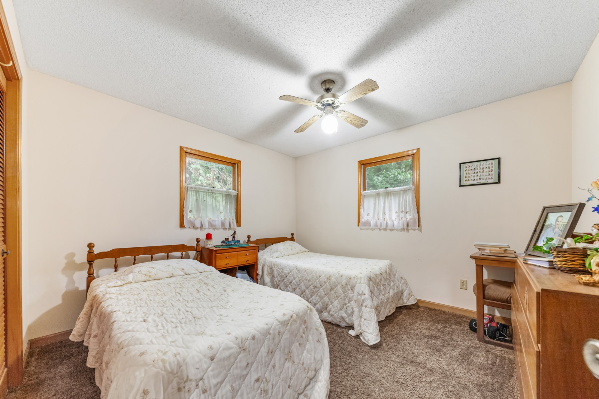 2756 Glasscock Road Lewisburg, TN 37091 - Photo 20 of 48 a bedroom with two beds and a chandelier