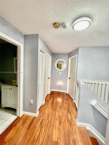 a bedroom with a bed and a view of bathroom