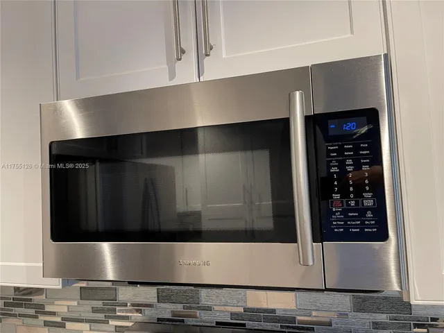 a refrigerator freezer sitting inside of a kitchen