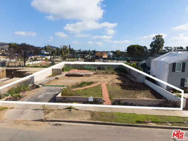 a view of swimming pool with outdoor seating and city view
