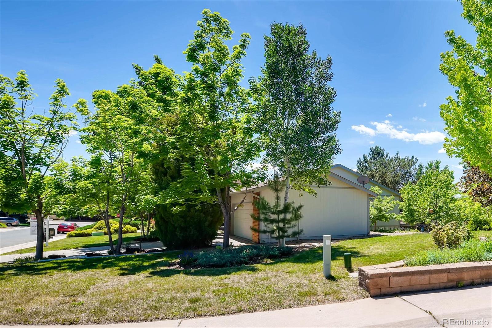 69 Prairie Ridge Road Highlands Ranch, CO 80126 - Photo 28 of 28 a view of backyard with plants and outdoor seating
