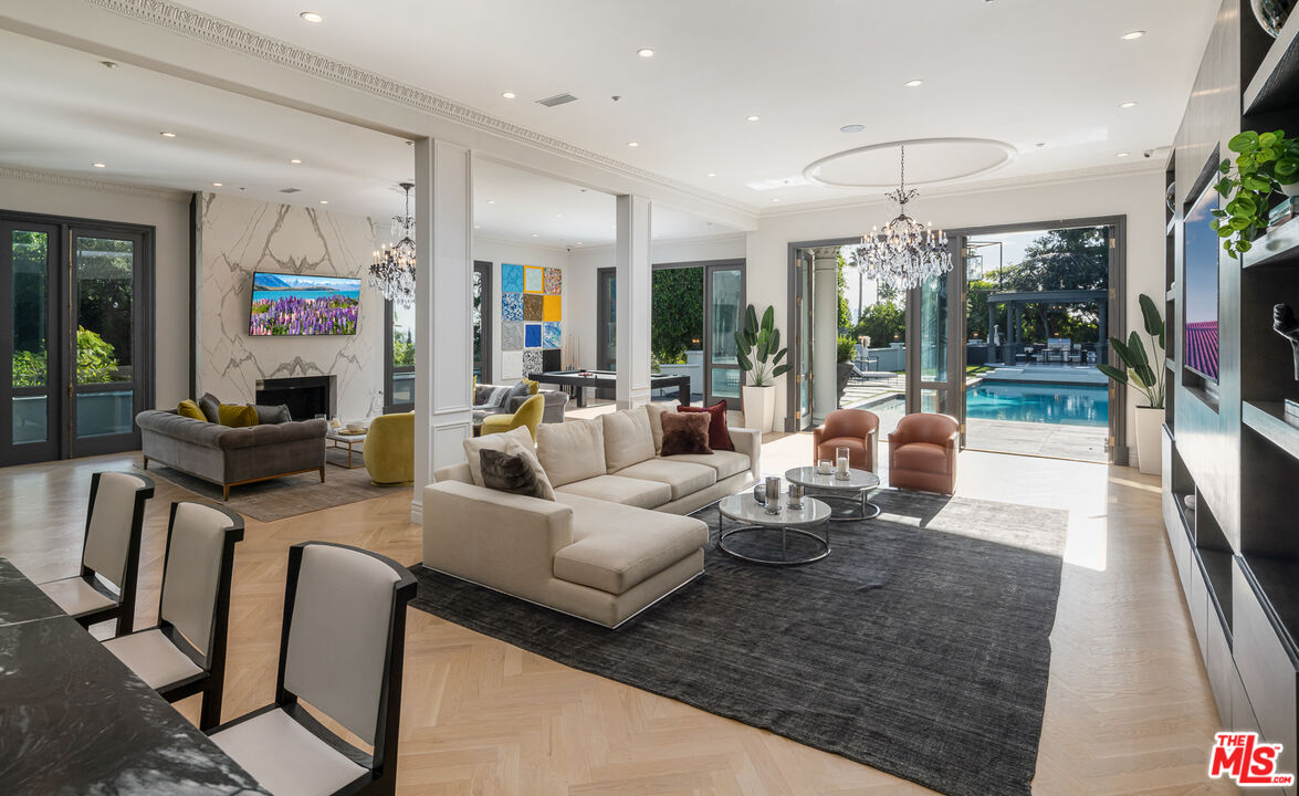 402 Doheny Road Beverly Hills, CA 90210 - Photo 12 of 55 a living room with furniture and a large window