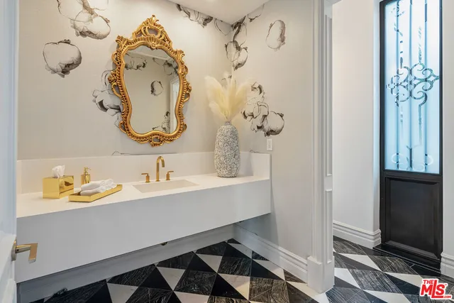 a view of entryway with chandelier and glass door