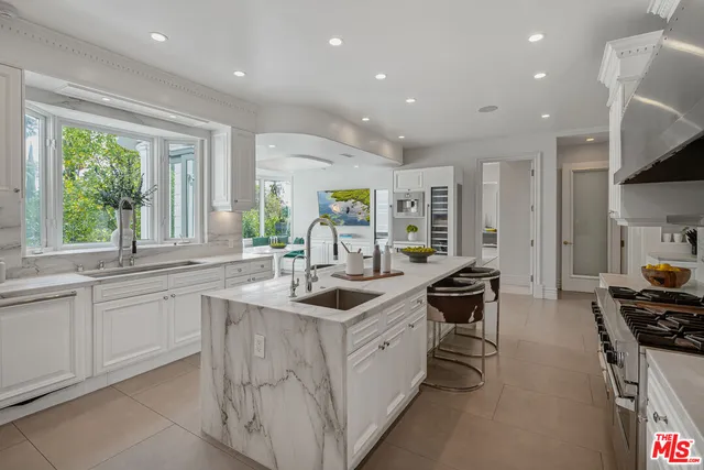 a kitchen with a sink and a large window