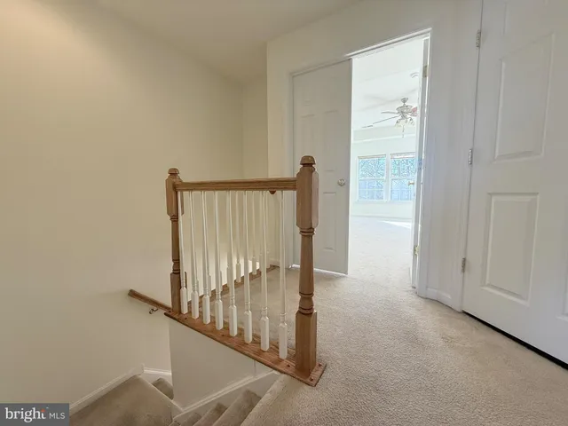 a view of a hallway with staircase