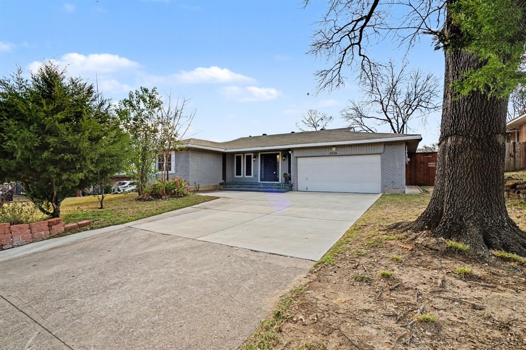 1714 East Union Bower Road Irving, TX 75061 - Photo 1 of 32 a house with a tree in front of it