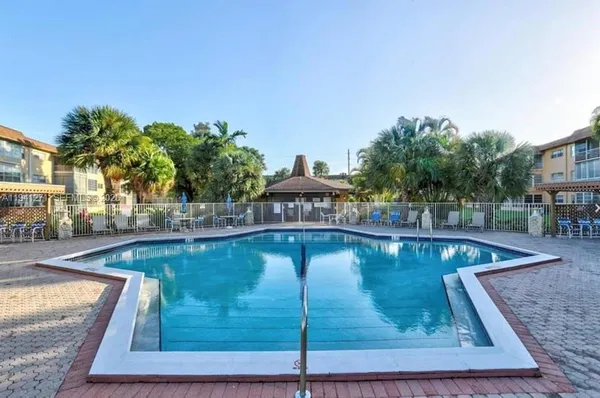 a view of a swimming pool with a patio