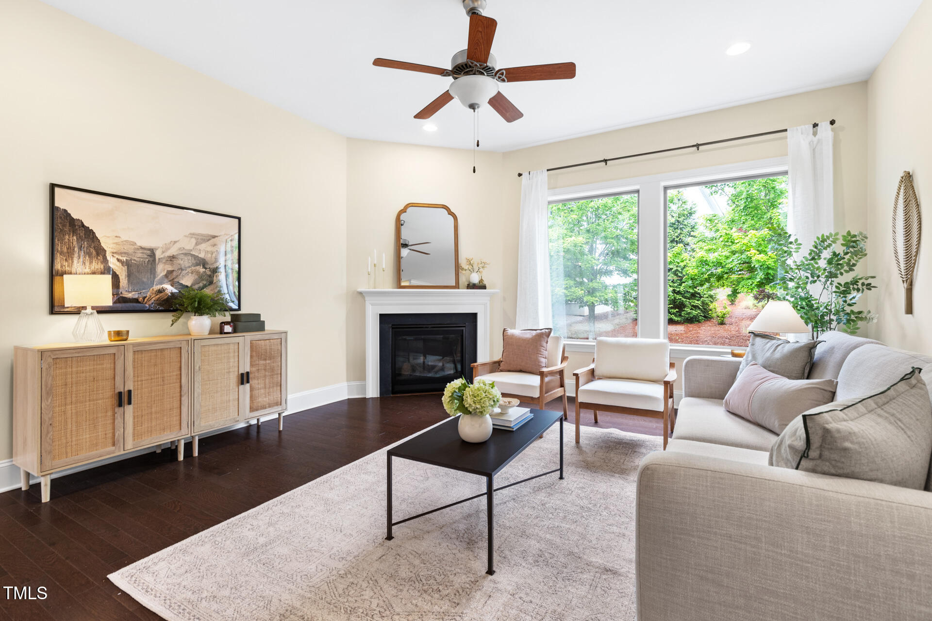 204 Mill Chapel Road Chapel Hill, NC 27517 - Photo 12 of 38 a living room with furniture a fireplace and a large window
