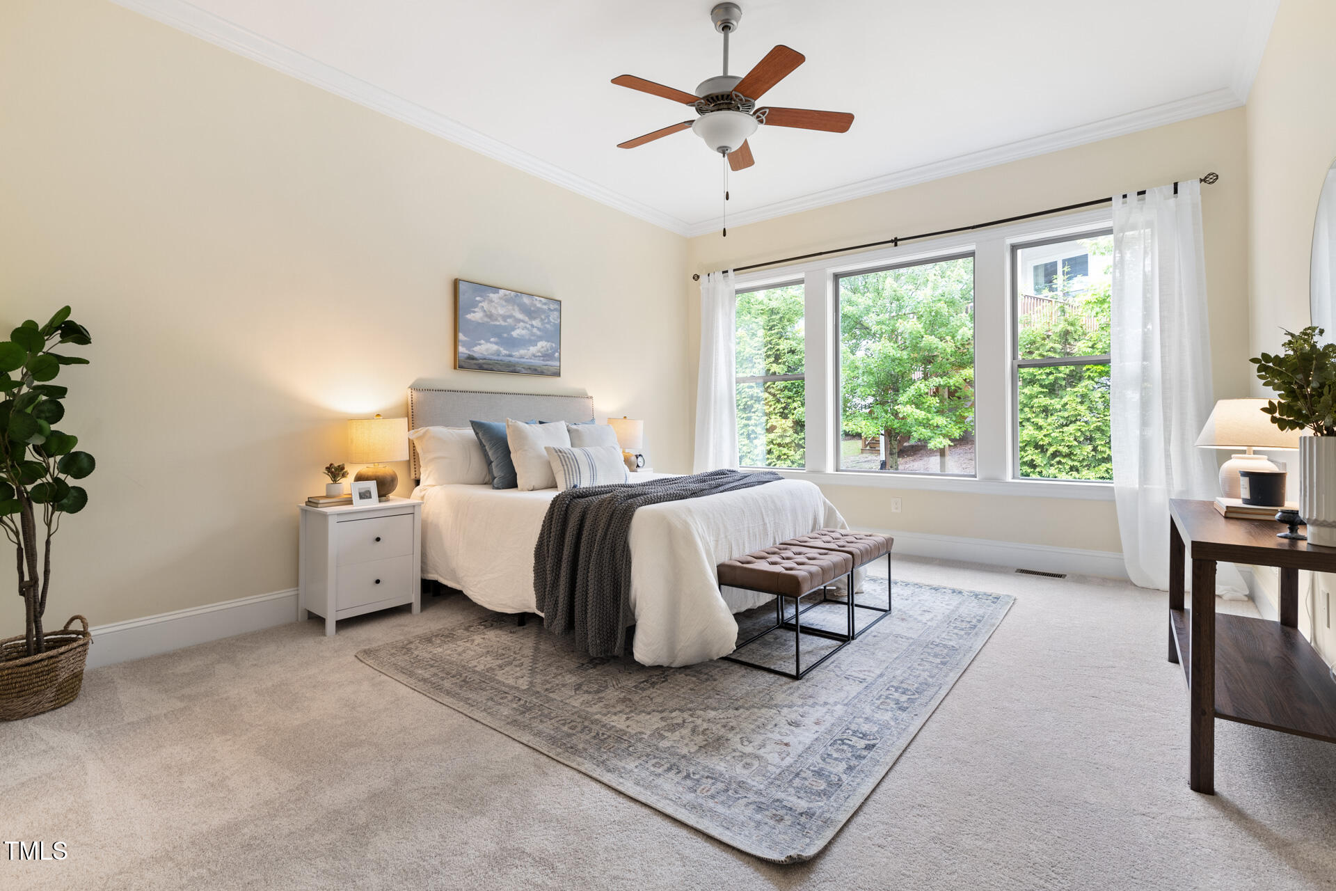 204 Mill Chapel Road Chapel Hill, NC 27517 - Photo 21 of 38 a spacious bedroom with a bed and a table in it