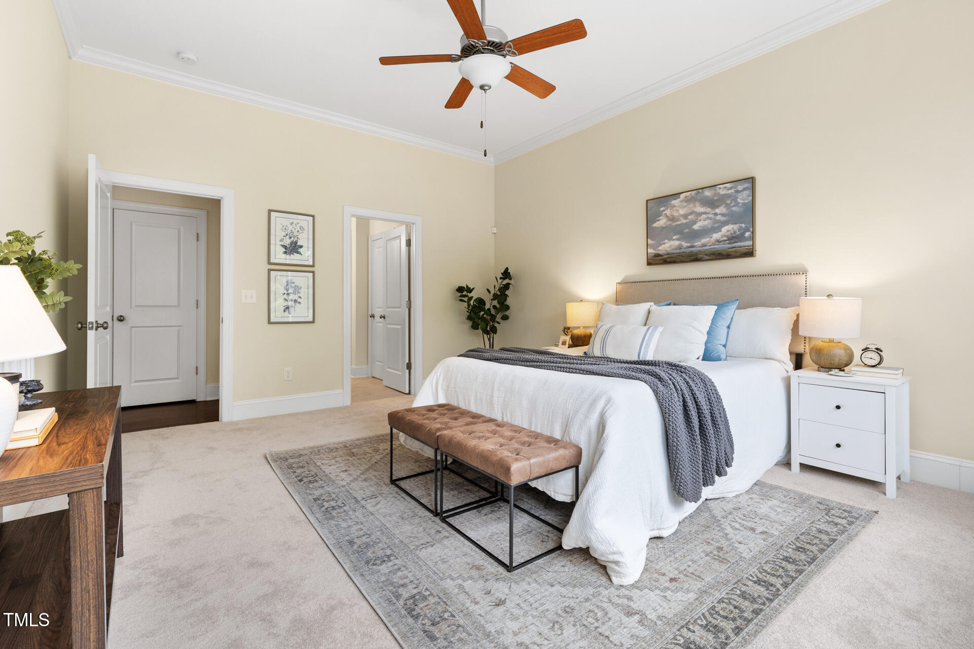 204 Mill Chapel Road Chapel Hill, NC 27517 - Photo 24 of 38 a spacious bedroom with a bed and painting on the wall
