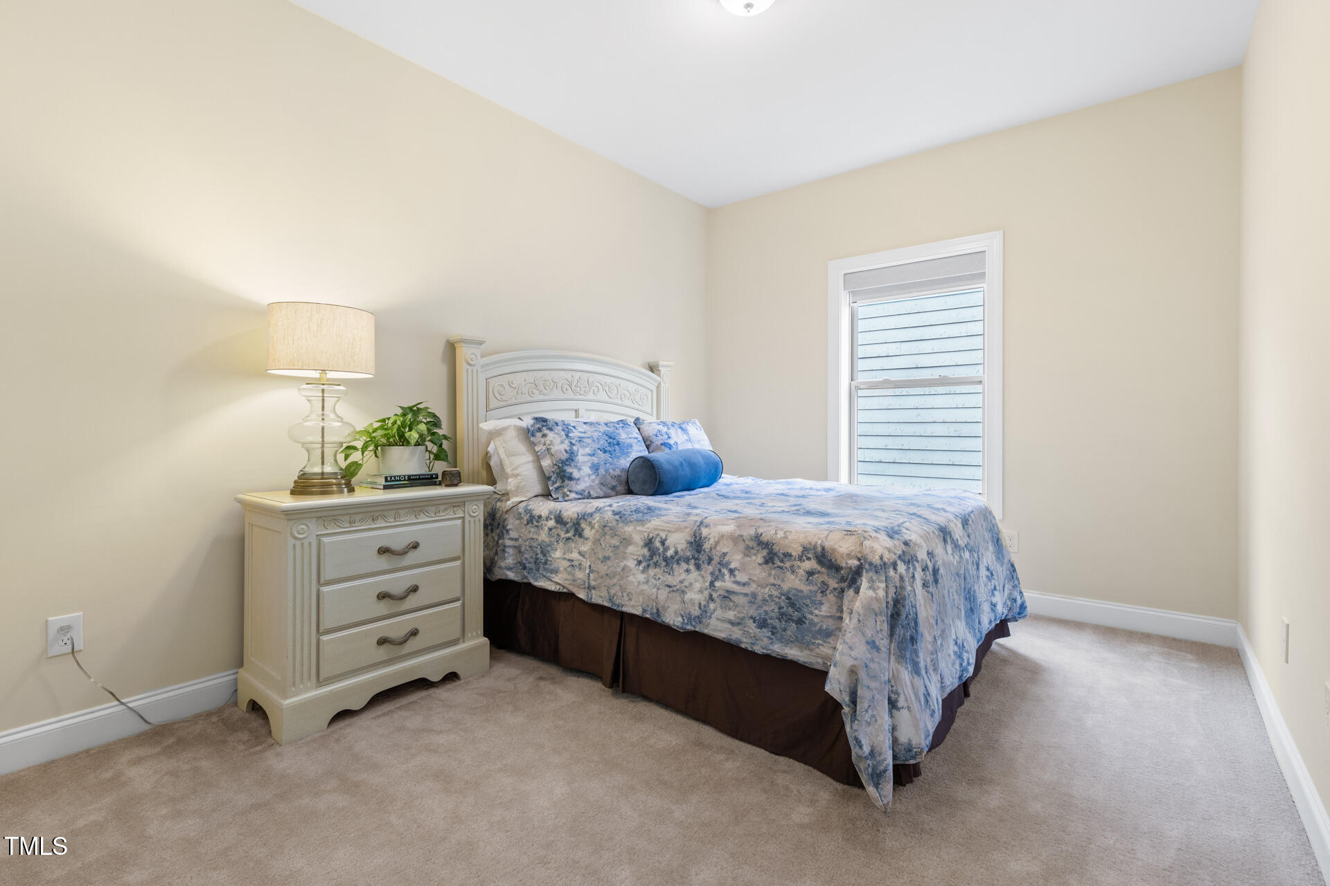 204 Mill Chapel Road Chapel Hill, NC 27517 - Photo 31 of 38 a bedroom with a bed and a window