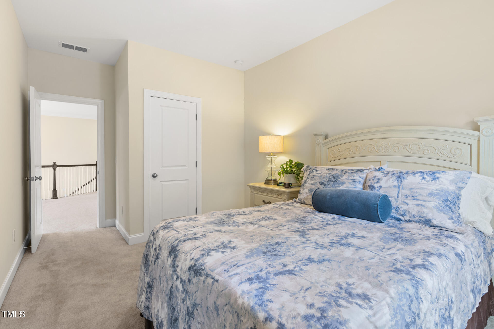 204 Mill Chapel Road Chapel Hill, NC 27517 - Photo 32 of 38 a bedroom with a large bed and a potted plant