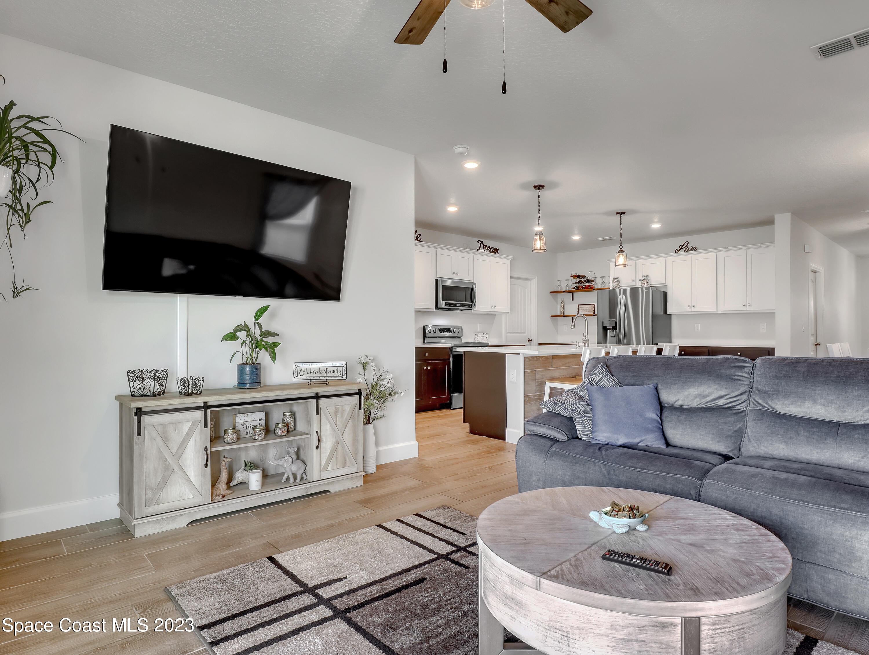 1807 Elkins Point Melbourne, FL 32935 - Photo 20 of 52 a living room with furniture and a flat screen tv