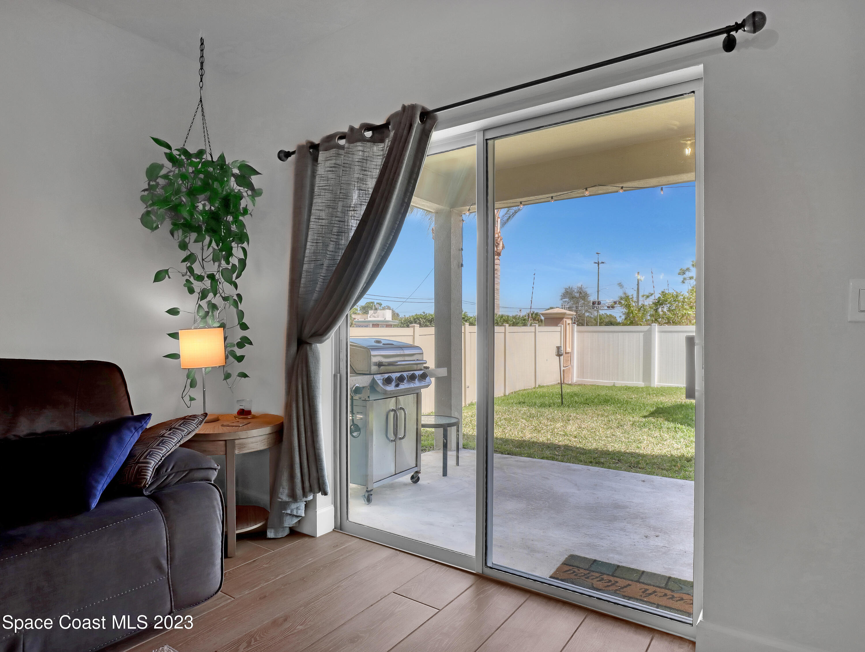 1807 Elkins Point Melbourne, FL 32935 - Photo 21 of 52 a living room with furniture and a potted plant