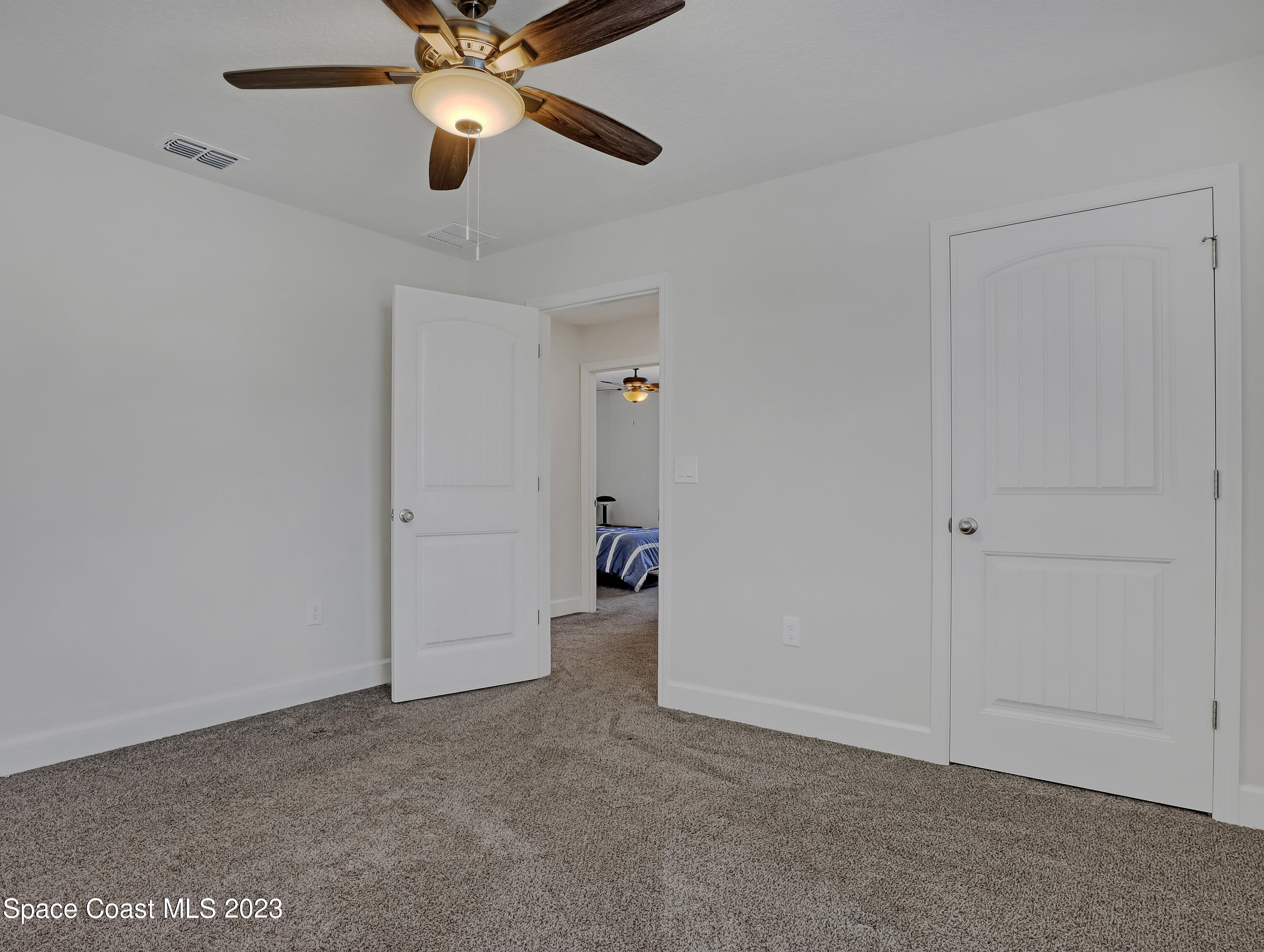 1807 Elkins Point Melbourne, FL 32935 - Photo 34 of 52 a view of an empty room and chandelier fan