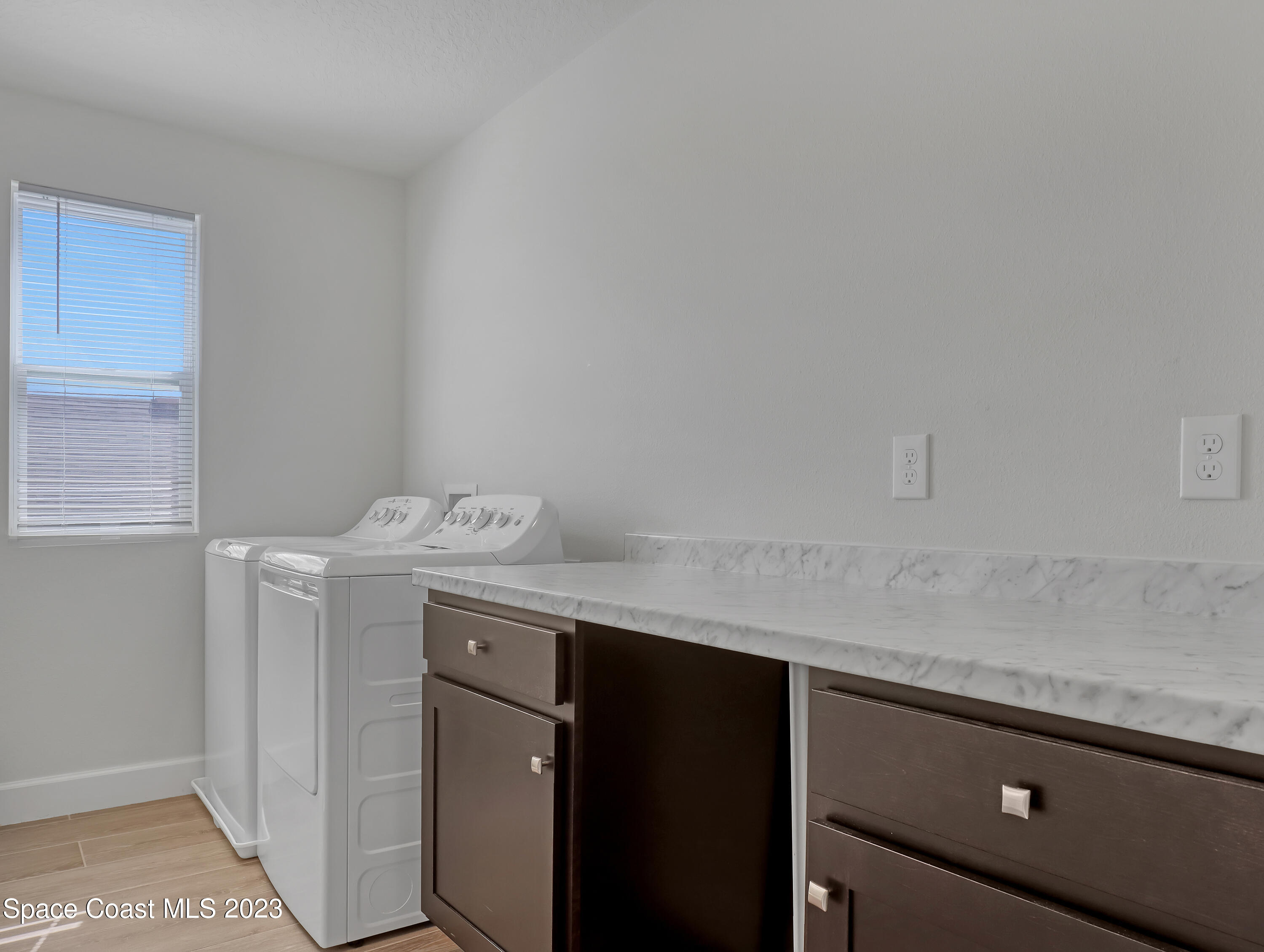 1807 Elkins Point Melbourne, FL 32935 - Photo 40 of 52 a utility room with dryer and washer