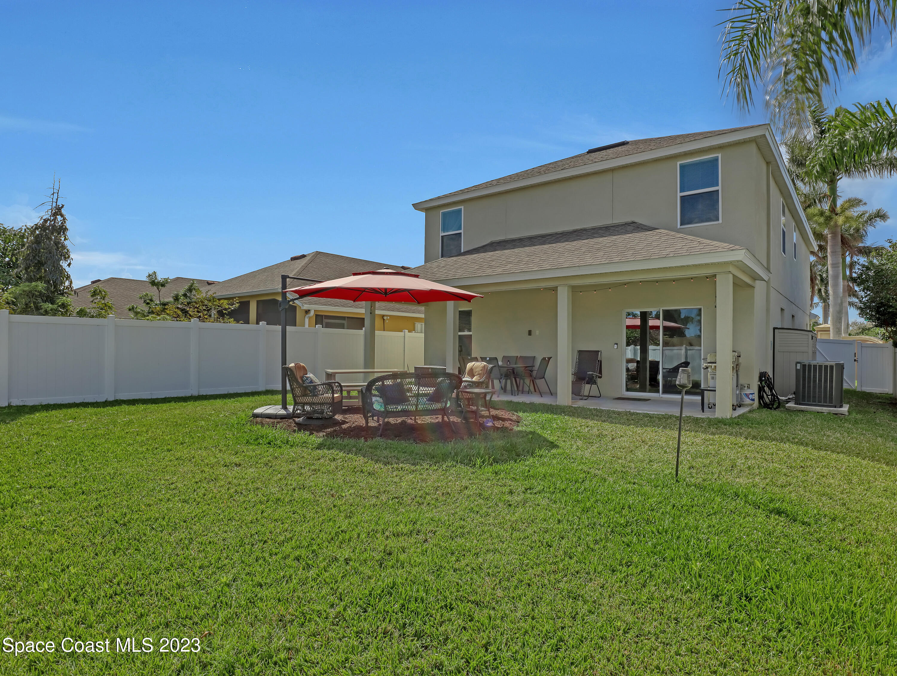 1807 Elkins Point Melbourne, FL 32935 - Photo 46 of 52 a view of a house with a yard porch and sitting area