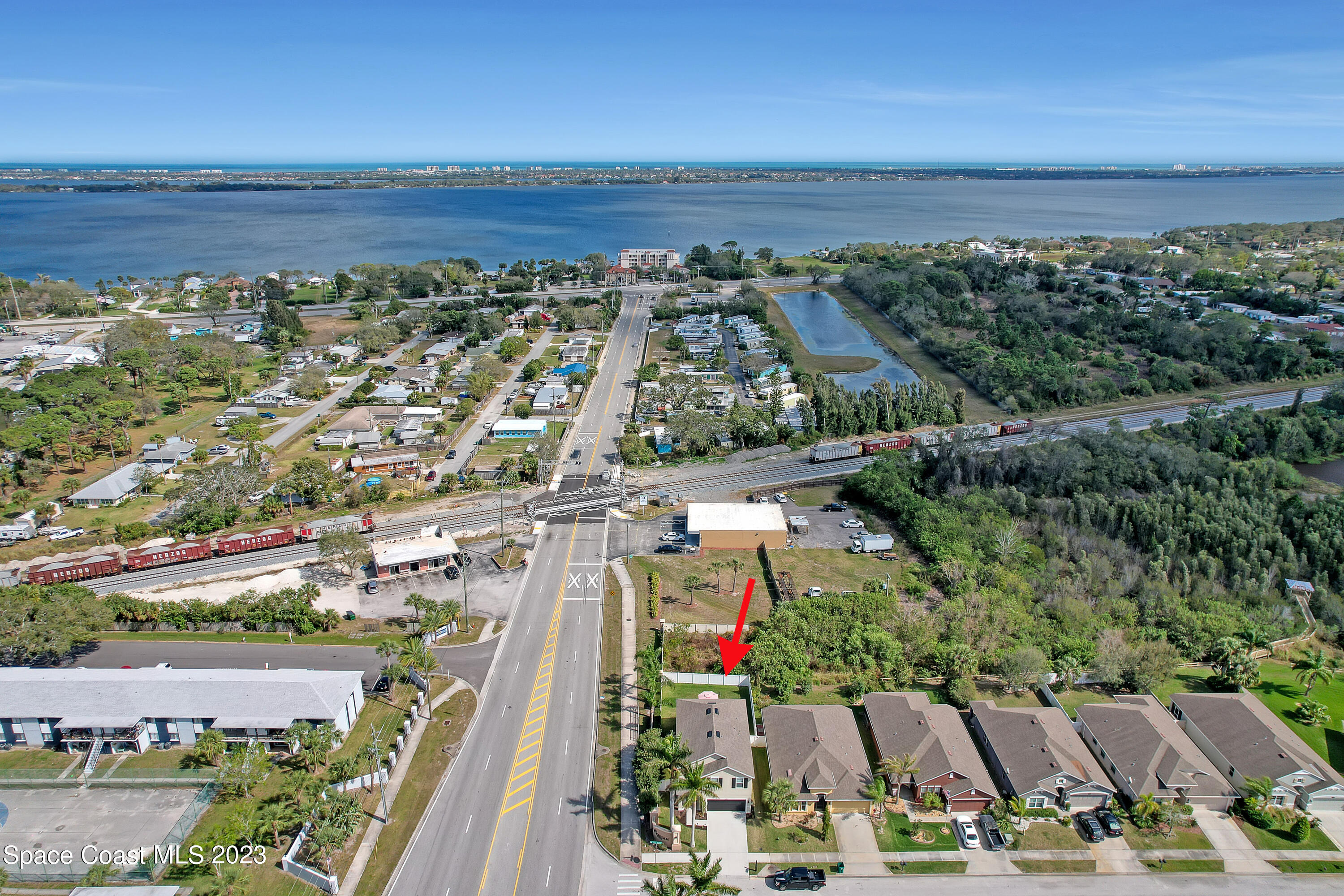 1807 Elkins Point Melbourne, FL 32935 - Photo 49 of 52 a view of a city with an ocean