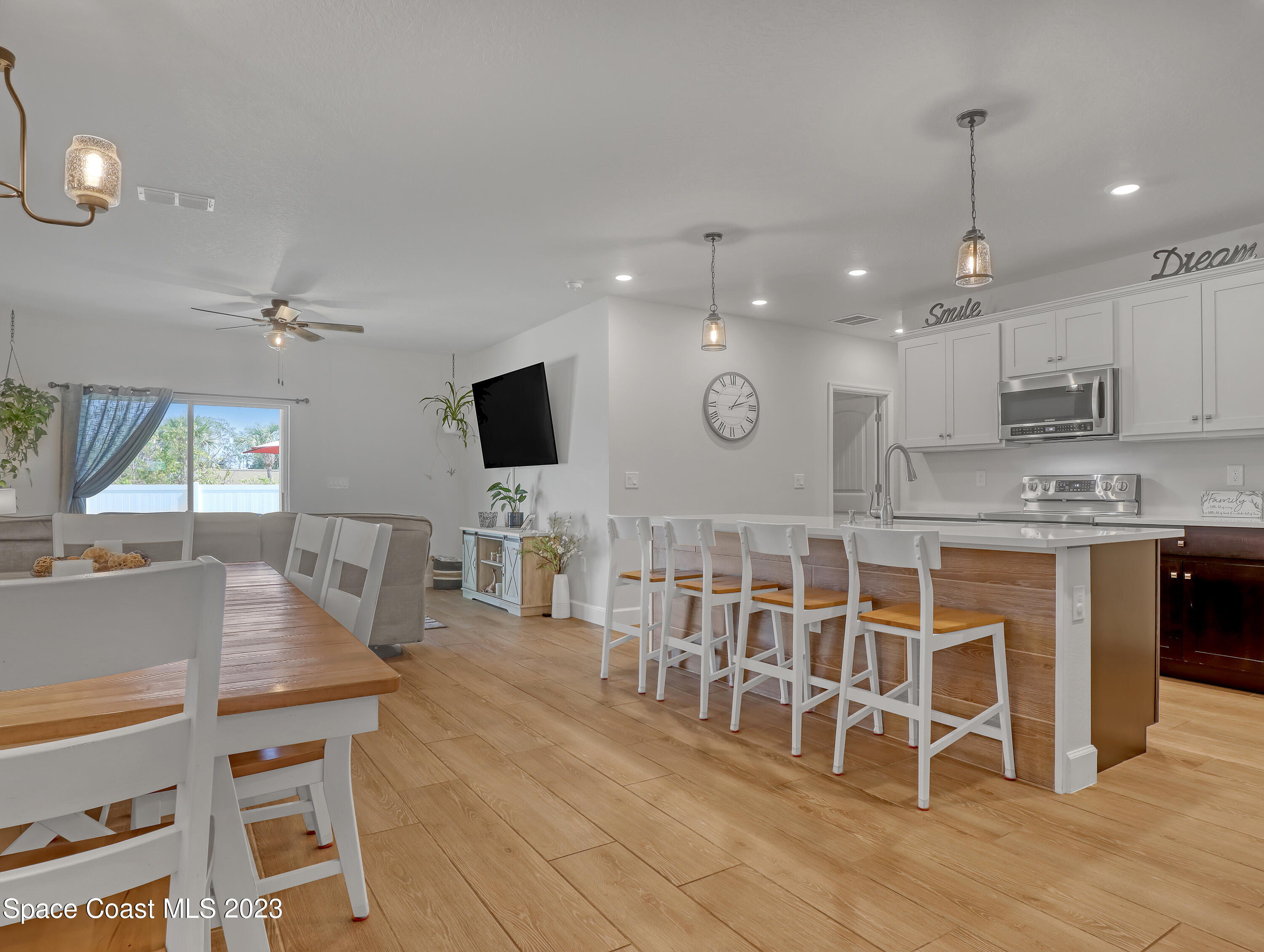 1807 Elkins Point Melbourne, FL 32935 - Photo 8 of 52 a large kitchen with a table and chairs in it
