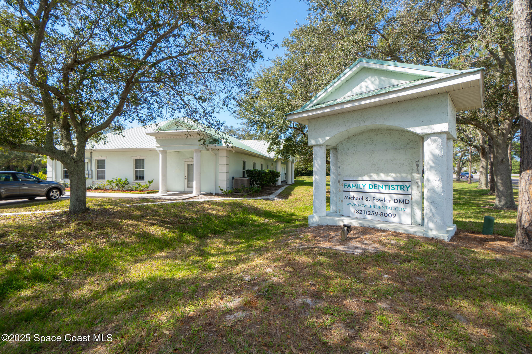 38 Suntree Place, Unit 2 Melbourne, FL 32940 - Photo 11 of 52 a view of a house with backyard and a tree