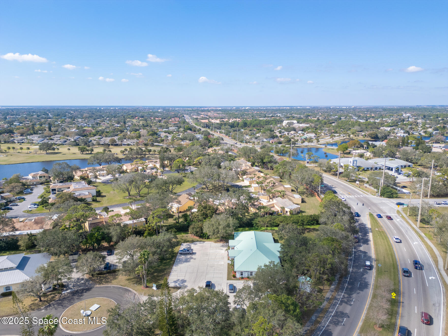 38 Suntree Place, Unit 2 Melbourne, FL 32940 - Photo 20 of 52 an aerial view of a city with lots of residential buildings