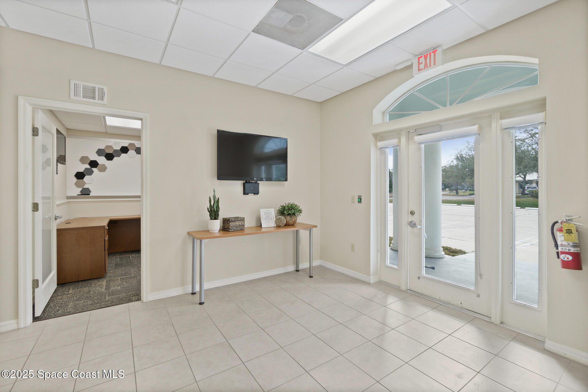 38 Suntree Place, Unit 2 Melbourne, FL 32940 - Photo 22 of 52 a living room with furniture and a flat screen tv