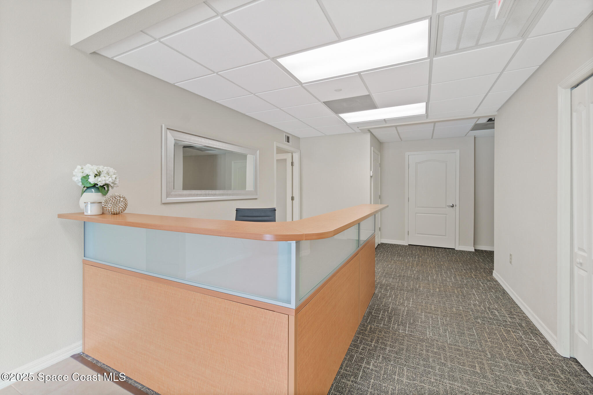 38 Suntree Place, Unit 2 Melbourne, FL 32940 - Photo 25 of 52 a view of an entryway with wooden floor