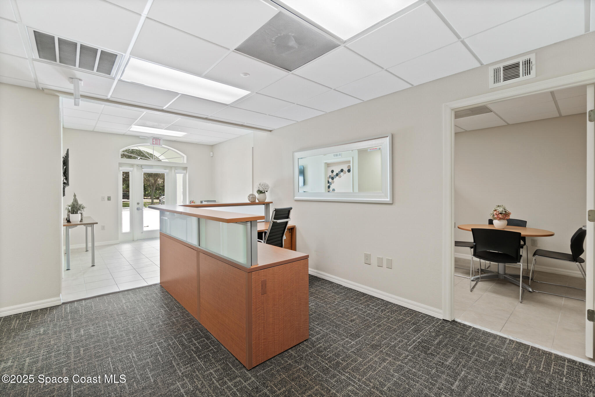 38 Suntree Place, Unit 2 Melbourne, FL 32940 - Photo 26 of 52 a living room with furniture and a wooden floor