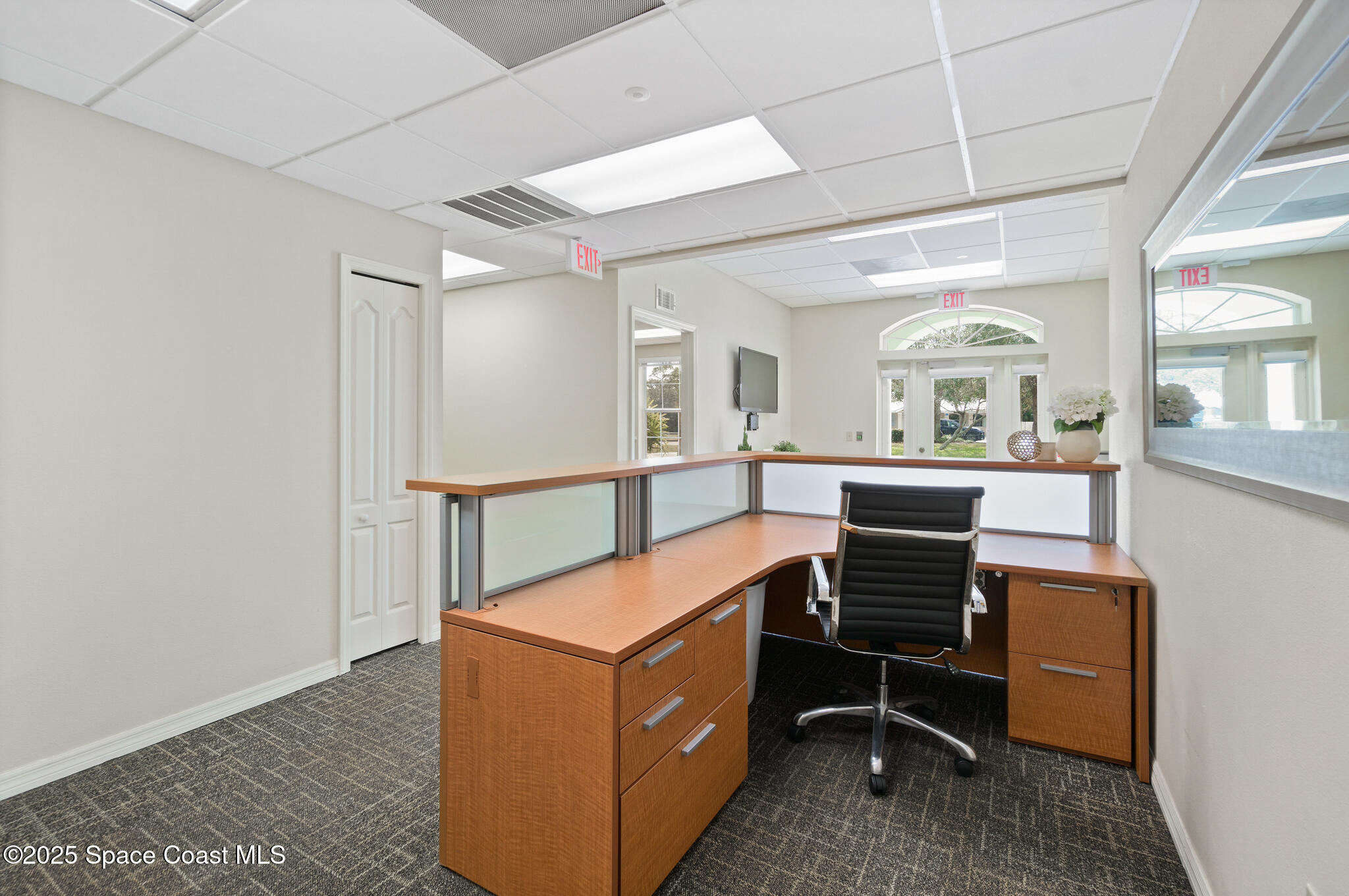 38 Suntree Place, Unit 2 Melbourne, FL 32940 - Photo 27 of 52 a room with furniture a rug and a window