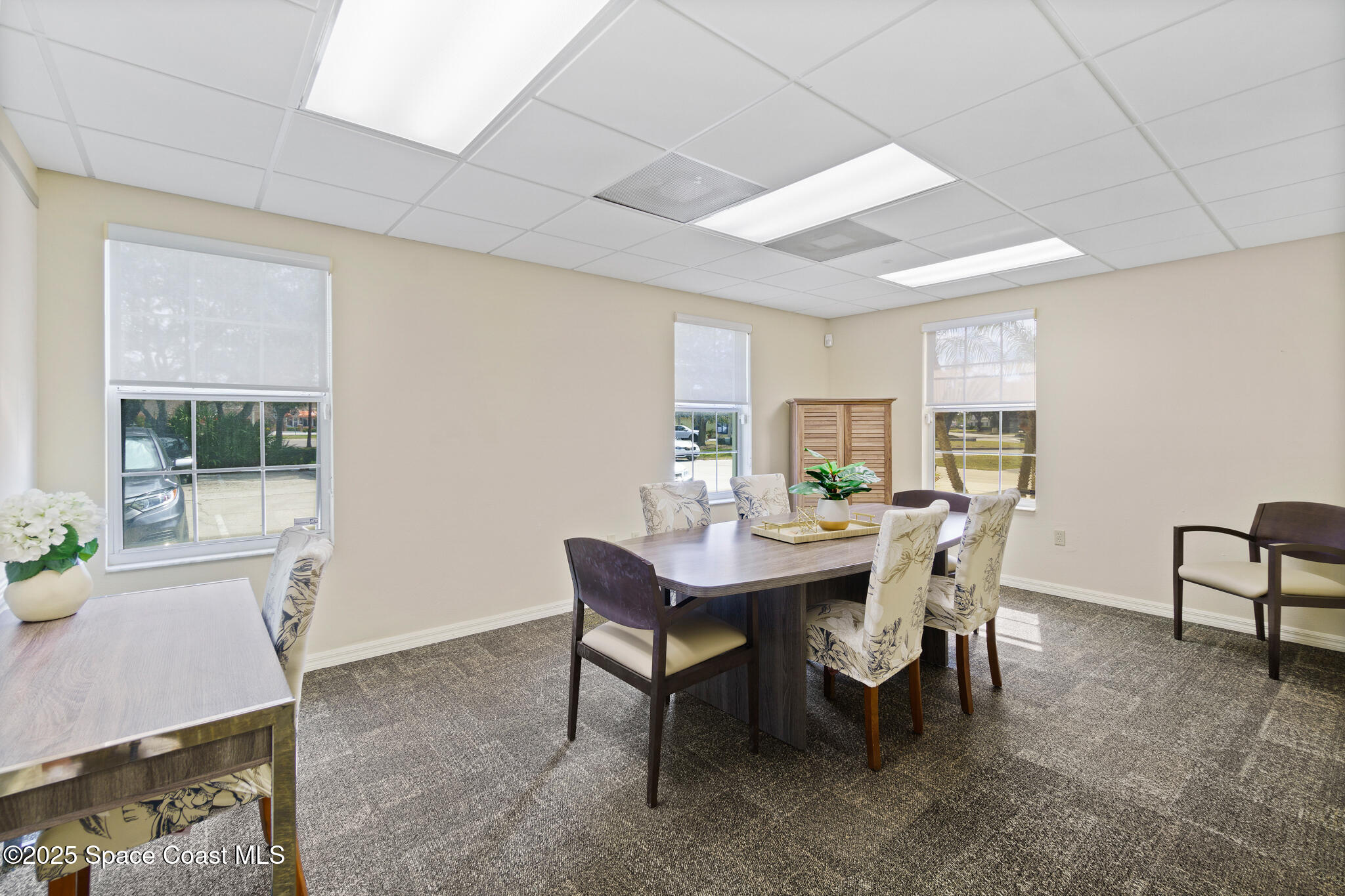38 Suntree Place, Unit 2 Melbourne, FL 32940 - Photo 30 of 52 a view of a dining room with furniture