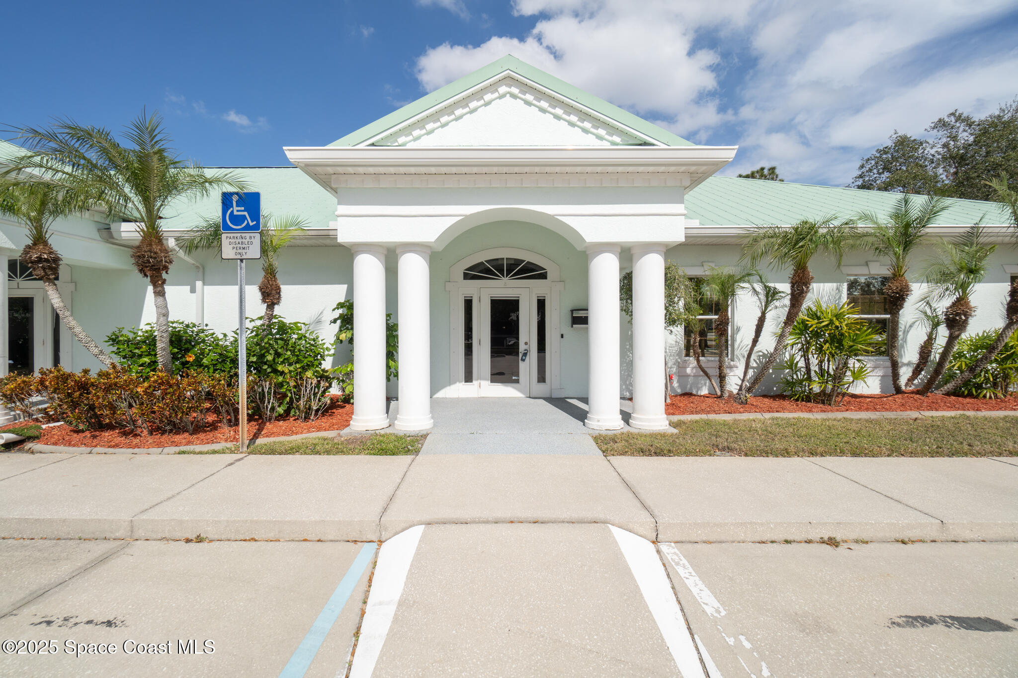 38 Suntree Place, Unit 2 Melbourne, FL 32940 - Photo 3 of 52 a view of a house with potted plants