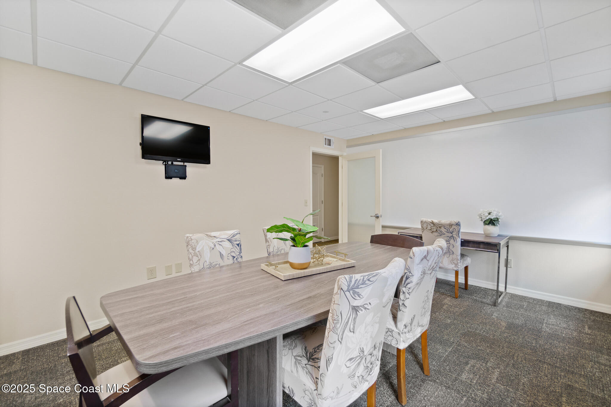 38 Suntree Place, Unit 2 Melbourne, FL 32940 - Photo 31 of 52 a view of a dining room with furniture