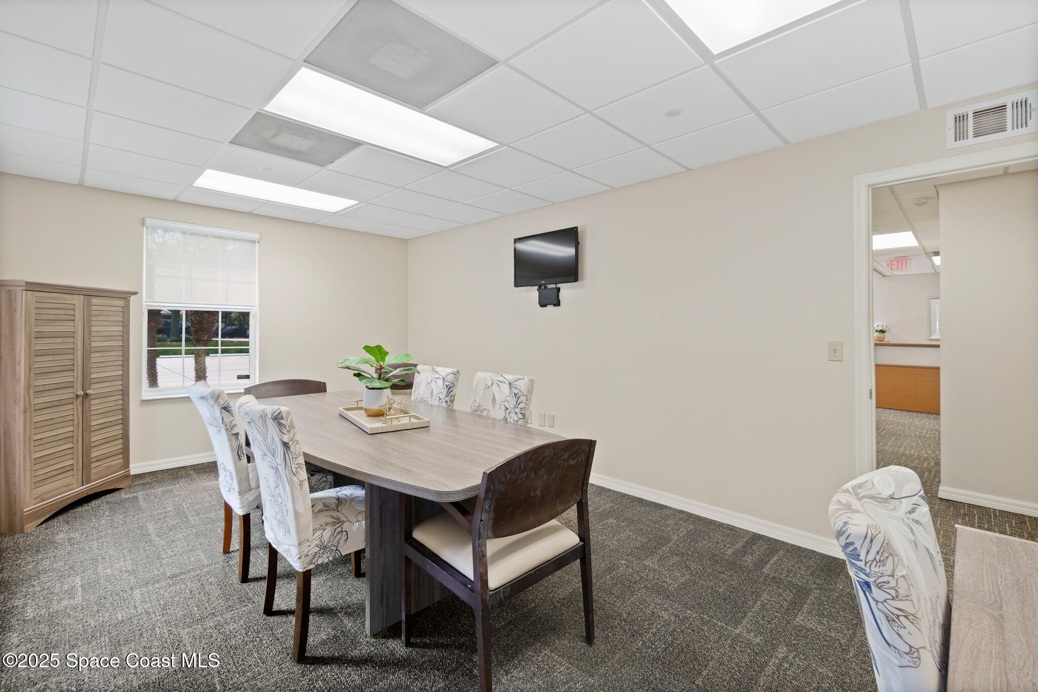 38 Suntree Place, Unit 2 Melbourne, FL 32940 - Photo 32 of 52 a view of a dining room with furniture