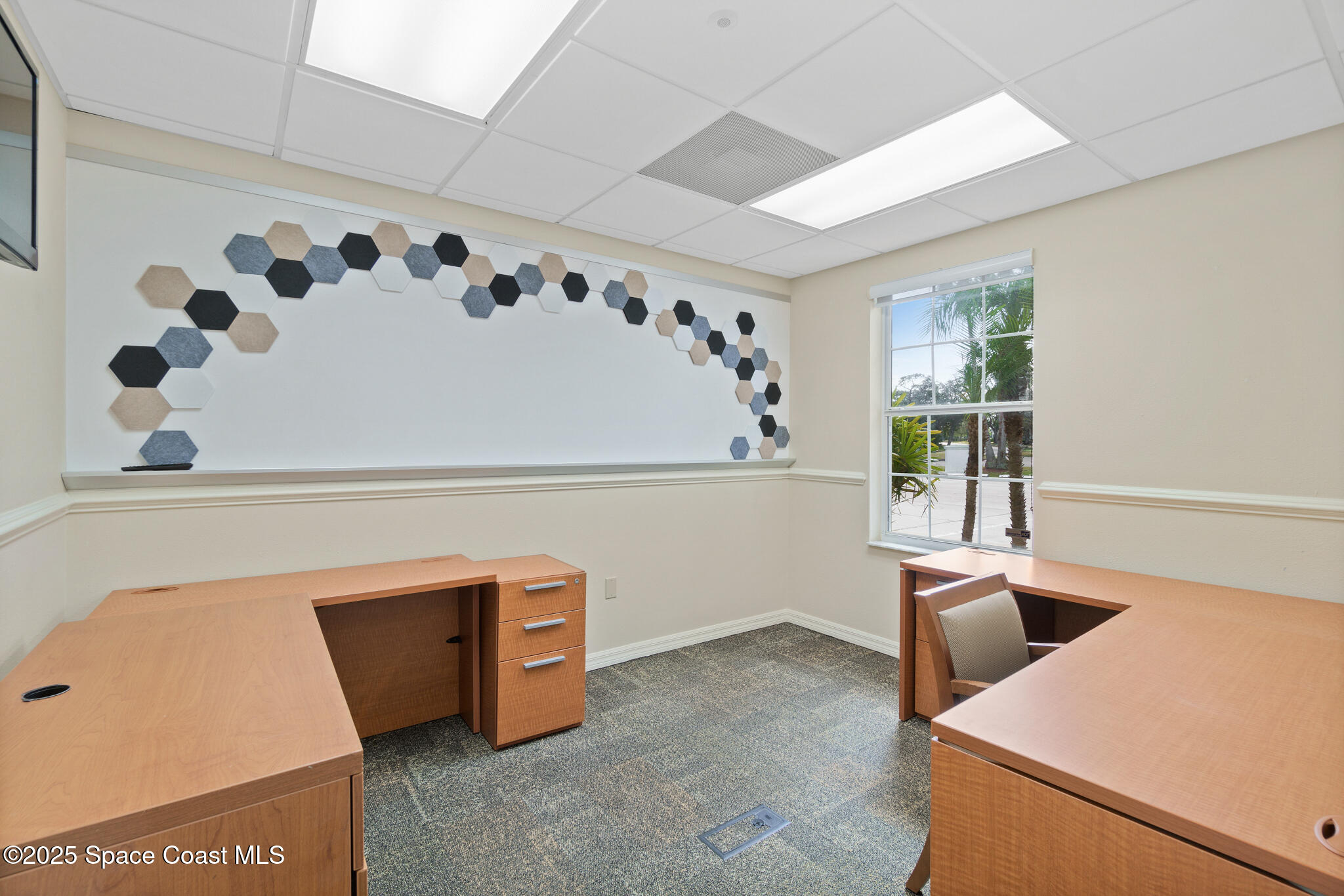 38 Suntree Place, Unit 2 Melbourne, FL 32940 - Photo 42 of 52 a view of kitchen with furniture and window