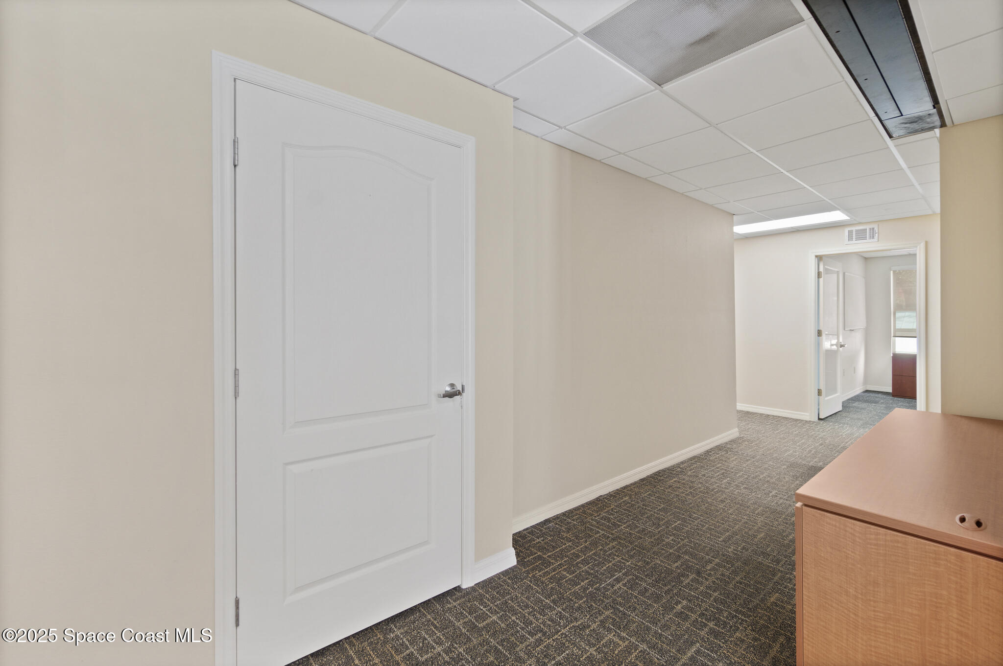 38 Suntree Place, Unit 2 Melbourne, FL 32940 - Photo 46 of 52 a view of a kitchen from the hallway