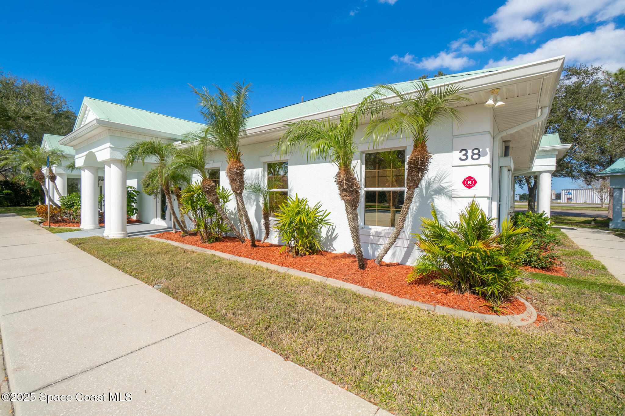 38 Suntree Place, Unit 2 Melbourne, FL 32940 - Photo 7 of 52 a front view of a house having yard