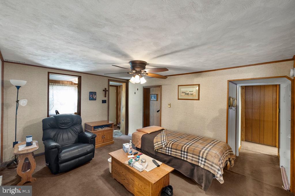 470 Racetrack Road Abbottstown, PA 17301 - Photo 15 of 54 a bedroom with furniture and a chandelier