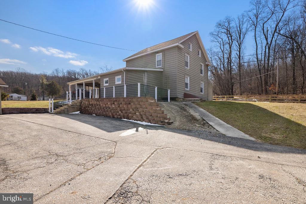 470 Racetrack Road Abbottstown, PA 17301 - Photo 2 of 54 a front view of a house with a yard and garage