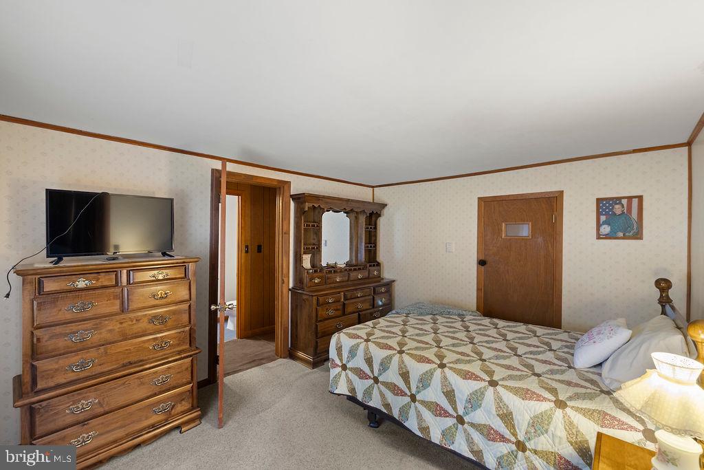 470 Racetrack Road Abbottstown, PA 17301 - Photo 21 of 54 a bedroom with a bed and a flat screen tv