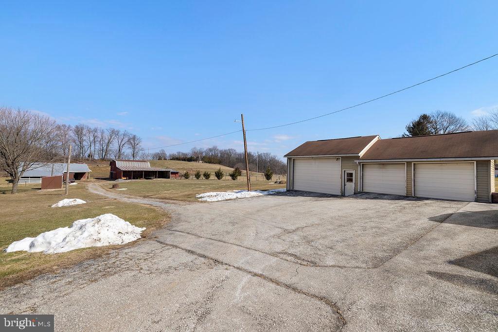 470 Racetrack Road Abbottstown, PA 17301 - Photo 40 of 54 a view of a white house with a snow on the road