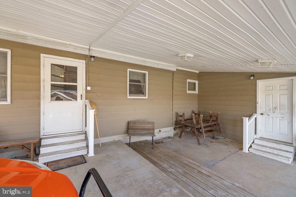 470 Racetrack Road Abbottstown, PA 17301 - Photo 5 of 54 a backyard of a house with table and chairs