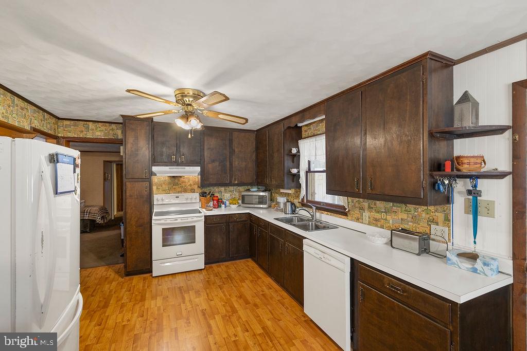 470 Racetrack Road Abbottstown, PA 17301 - Photo 8 of 54 a kitchen with stainless steel appliances granite countertop a sink stove and refrigerator