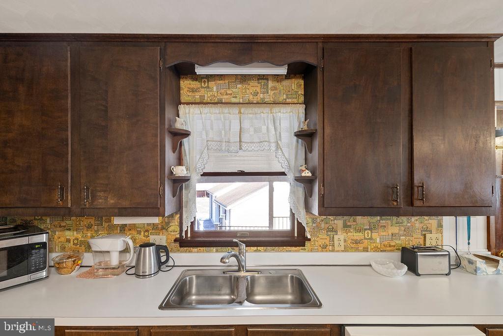 470 Racetrack Road Abbottstown, PA 17301 - Photo 10 of 54 a kitchen with a sink and a window