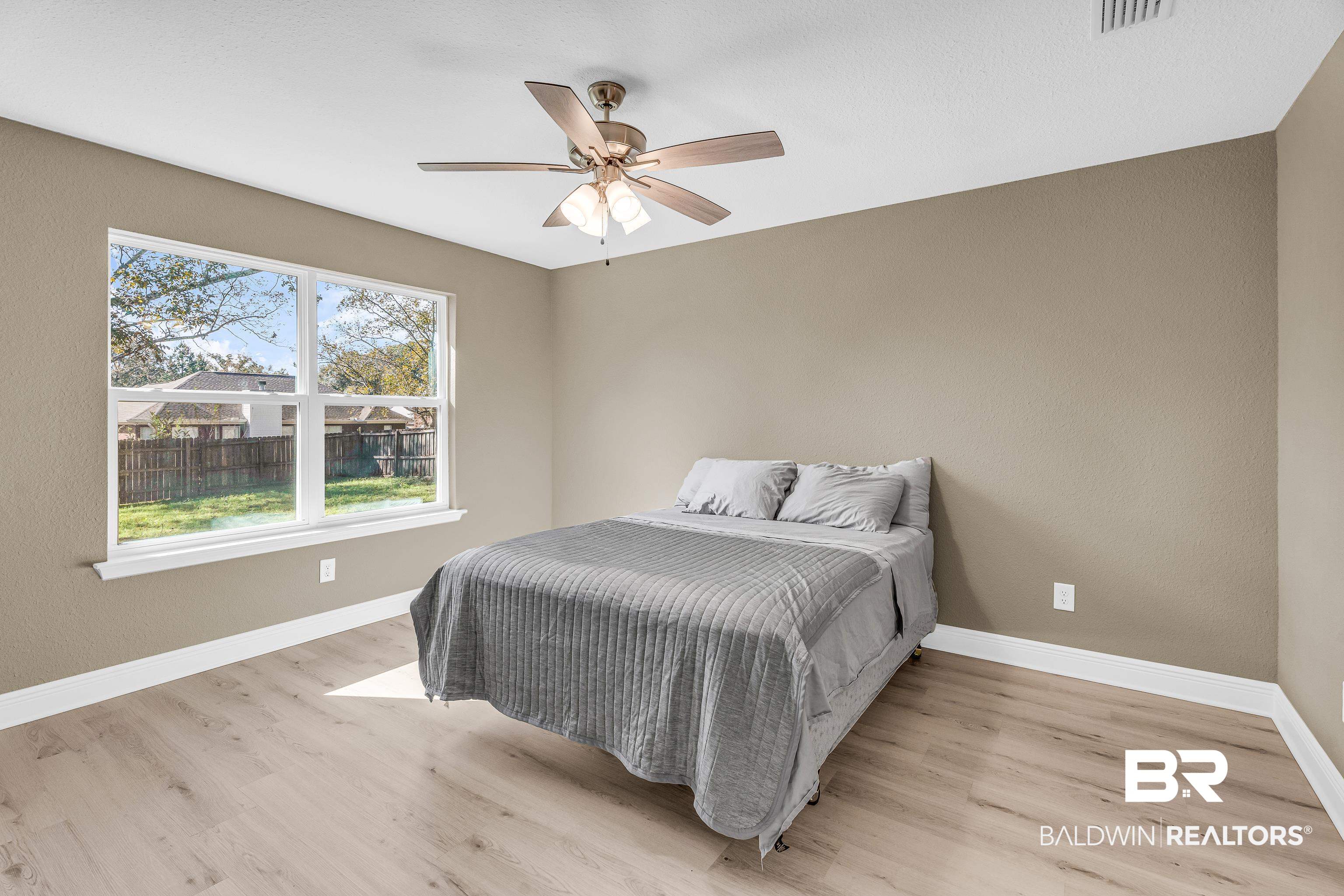 9206 Greenleaf Drive Daphne, AL 36527 - Photo 13 of 32 Bedroom with light wood-style floors and ceiling fan