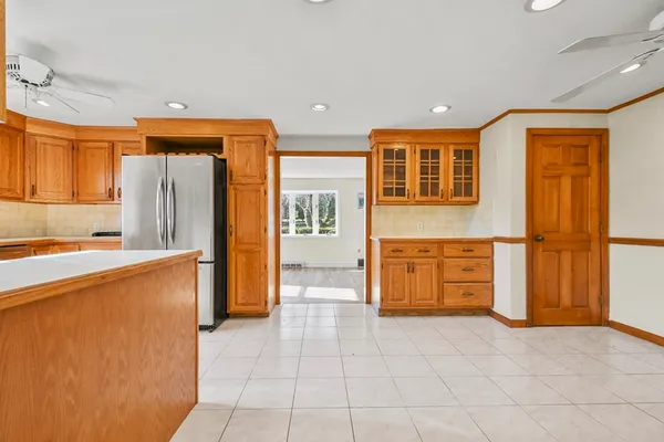 a kitchen with stainless steel appliances a refrigerator and cabinets