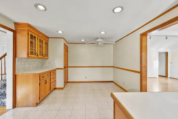 a view of a kitchen with a sink and a refrigerator
