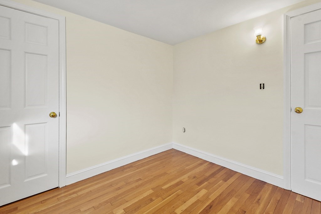 72 Cambridge Road, Unit 2 Woburn, MA 01801 - Photo 19 of 30 a view of empty room with wooden floor
